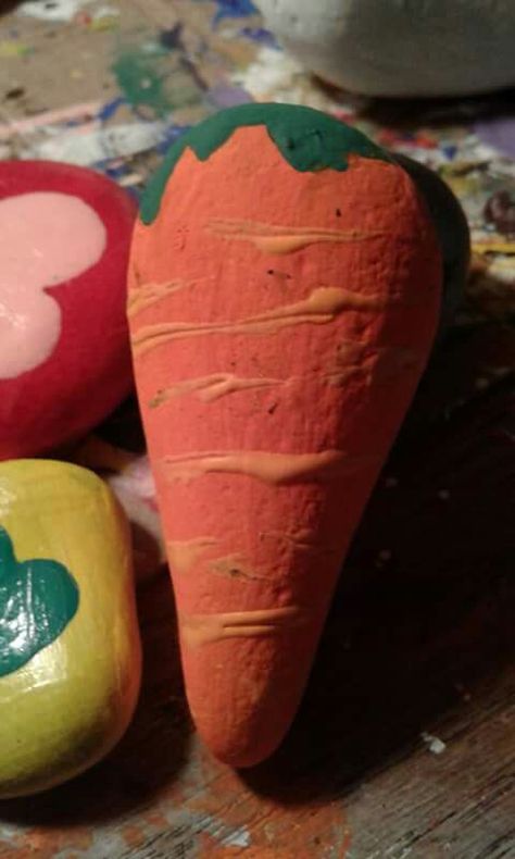 carrot painted rock Carrot Rock Painting, Carrot Painted Rocks, Carrot Painting Easy, Painted Garden Rocks Vegetables, Rock Painting Fruits And Veggies, Painted Rocks Kids Food, Painted Picnic Tables, Rock People, Easter 2024