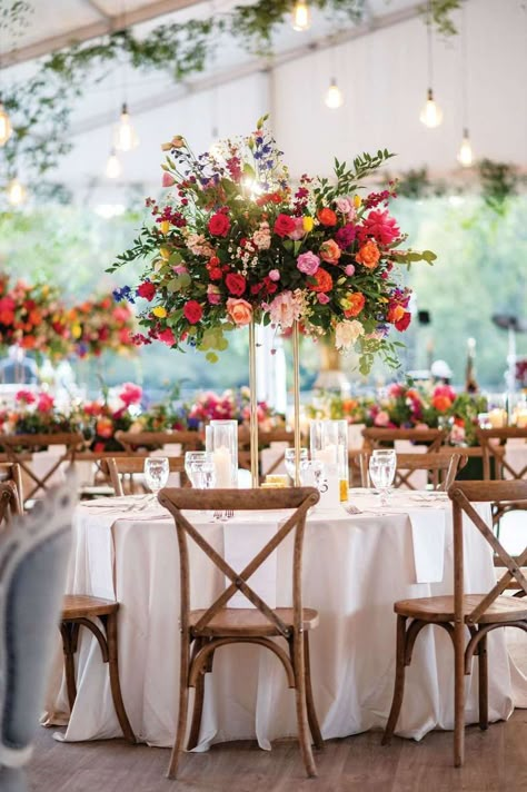 Bright Floral Wedding Table Settings, Tall Candlestick Centerpieces Wedding, Centerpiece For Wedding Reception, Wedding Flowers Arrangements Table, Tall Table Arrangements, Wedding Floral Arrangements Centerpieces Color Schemes, Raised Floral Centerpieces, Bright Wedding Aesthetic, Bridgerton Wedding Table Setting