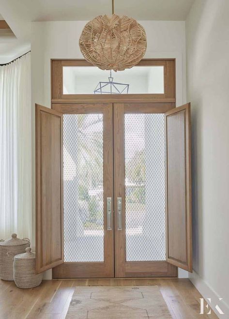 A Florida house gets beautifully renovated into a coastal contemporary retreat Florida Front Door, Hallway Pendant Light, Coastal Foyer, Beach House Front Door, Architectural Windows, Wood Front Entry Doors, Interior Door Hardware, Interior Door Knobs, Leaded Glass Door