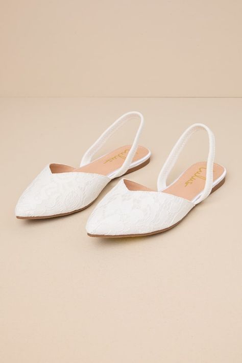 Step into style with the Lulus Mae White Lace Pointed-Toe Slingback Flats! These sweet cuties are the perfect blend of chic and sensible with their low-maintenance flat sole, comfortable elastic slingback strap, and cute notched pointed-toe upper composed of romantic floral lace. 0. 25" rubber heel. Lightly cushioned insole. Felted rubber sole has nonskid markings. Man made materials. Imported. Lulus | Mae White Lace Pointed-Toe Slingback Flats | Size 6.5. Comfortable Wedding Shoes For Bride Ballet Flats, Bridal Shoes No Heel, Flat Wedding Shoes For Bride Boho, Wedding Shoe Flats, White Bride Shoes, White Slingback Flats, Wedding Flats For Bride Sandals, Flat Wedding Shoes For Bride, Flat Bridal Shoes