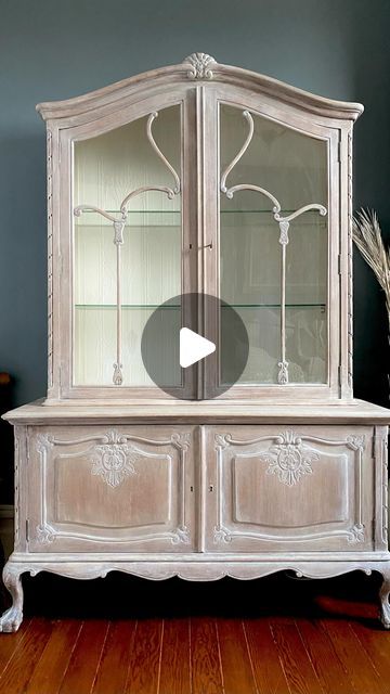 Christina Anna on Instagram: "Give old furniture finishes a new look with white wash!! Using a matte finish paint and create a ratio of 50% water and 50% white paint!  I add more embellishments with white wax to add to the wood details to create more depth and contrast to the wood details that surrounds this piece. You can start with some paint stripper to start but in my case it didn’t remove all the original stain but the white wash did result in the finish I was aiming for! ♥️ You can check my YouTube channel for more details on this piece and more DIY videos and projects, link in the bio!  #whitewash #whitewashfurniture #whitewax #mattefinish #chalkpaint #furnituremakeover #furnituretransformation #upcycledfurniture #reelsinstagram #oldworldfurniture" Whitewash Antique Furniture, Wax Furniture Finish Diy, Painting Furniture White Distressed, How To Make White Wash Paint, White Wax On Dark Wood Painted Furniture, How Do You White Wash Wood, Minwax Color Wash White Wash, French Country Hutch, White Wash Wood Furniture