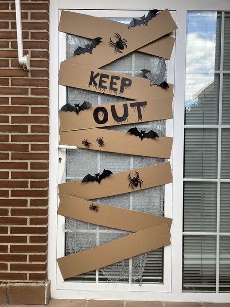 30+ Easy DIY Indoor Halloween Decorations Which Are Spooky And So Much Easy To Do - RecipeMagik Homemade Spiders For Halloween, Office Door Halloween Decorations Ideas, Simple Haloween Decoracion, Halloween Decor Cheap Diy, Halloween Clinic Decorations, Halloween School Hallway Ideas, Haunted House Theme Decor, Halloween Ladder Decorations, Creative Halloween Decor