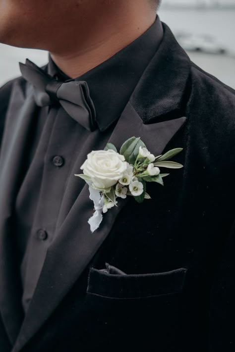 Black Suit Boutonniere, Wedding Flower For Groom, Ivory And Green Boutonniere, Green And White Wedding Boutonniere, All Black Suit With Sage Green Tie, Emerald Green Wedding Boutonniere, Groom Black Suit Sage Green Tie, Green White Boutonniere, Sage Green Boutonniere Groomsmen