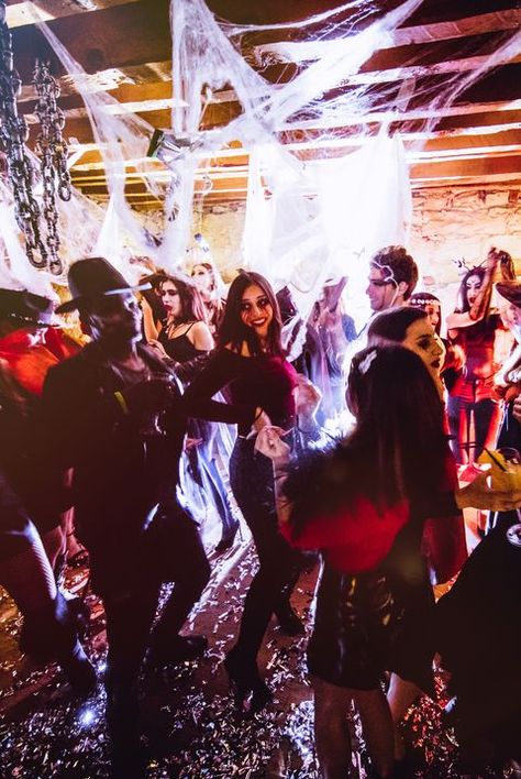 Multi-ethnic people in Halloween costumes having fun at dungeon nightclub Alchemy Aesthetic, Halloween Timeline, Halloween Drinking Games, Horror Movie Night, Halloween Club, Halloween Songs, Party Night Club, Black Halloween Dress, Tech Gift