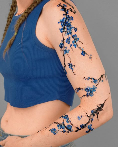 𝗘.𝗻𝗮𝗹 on Instagram: “Brushstroke Branch Sleeve with Blue Flower 🌸 The guest was dressed in all blue, from her clothes to her shoes 💙 @e.nal.tattoo @vismstudio” Tato Naruto, Blue Flower Tattoos, Flower Vine Tattoos, Blue Ink Tattoos, Tato Maori, 16 Tattoo, Tato Minimal, Blue Rose Tattoos, Blue Tattoo