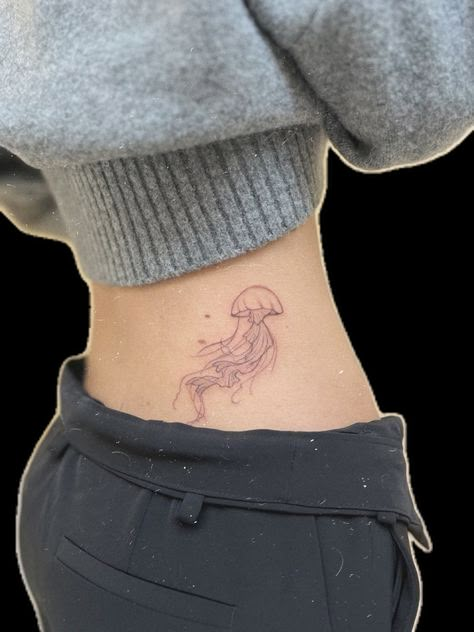 Hip Tattoo Jellyfish, Hip Jellyfish Tattoo, Long Jellyfish Tattoo, Jellyfish Tattoo On Hip, Aesthetic Jellyfish Tattoo, Jellyfish Stomach Tattoo, Jellyfish Tattoo On Back, Tattoo Ideas Female Jellyfish, Minimal Jellyfish Tattoo