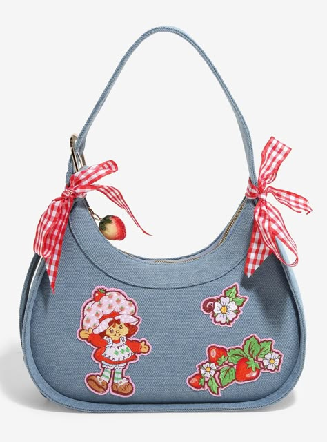 Look berry cute with this bag on your arm! This denim Strawberry Shortcake handbag is fastened with embroidered appliques of Strawberry  fruit  and flowers. Two checkered ribbons adorn the handles  while a strawberry zipper pull adds a charming touch.A BoxLunch Exclusive!DenimApprox. 12" W x 6 12" H x 3 12" DImported Strawberry Clothing, Denim Handbag, Vintage Strawberry Shortcake, Denim Handbags, Strawberry Fruit, Karate Kid, Pretty Bags, Cute Purses, Cute Bags