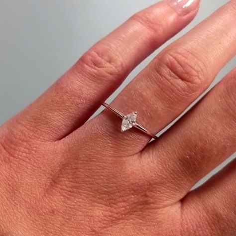 The minimalist engagement ring of dreams... 💍✨️ This pretty sterling silver ring features a simple marquise cut cz in a 4 prong setting. With just a 1mm band width and depth, it makes an ideal dainty and affordable engagement ring ready to be stacked with the future wedding ring! 😍 . . . #Engagement #Engaged #EngagementRing #SterlingSilver #Jewellery #Ring #MarquiseCut #MarquiseRing #BridalSet Rings Engagement Silver Simple, Minimalist Wedding Ring Silver, Simple Wedding Ring Stack, Silver Marquise Engagement Ring, Simple Engagement Rings Dainty, Affordable Engagement Ring, Minimalist Wedding Rings, Simple Engagement, Jewellery Ring