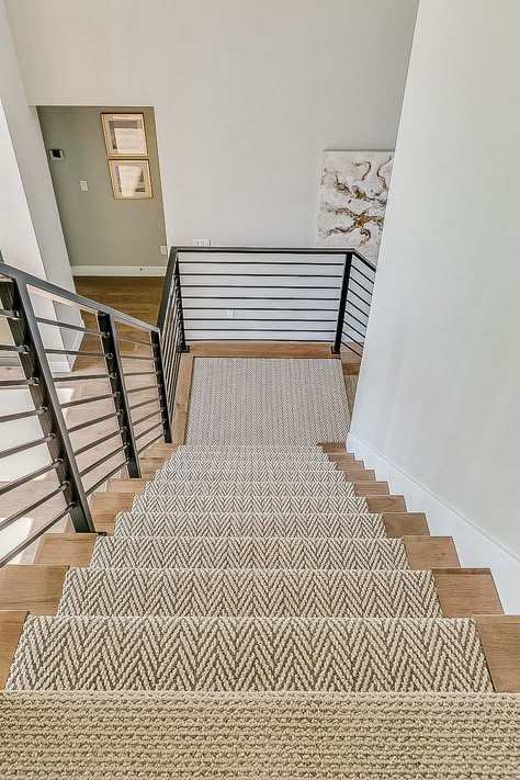 Beautiful stair runner with wood trim. Part of the 2019 parade of homes Stairs With Carpet Runner And Wood, Wood Carpet Stairs, Wood Stairs Runner, Farmhouse Stair Runner Ideas, Carpet With Wood Trim, Stairs With A Runner, Printed Carpet On Stairs, Stair Runner Wood Stairs, Stair Runner Inspiration