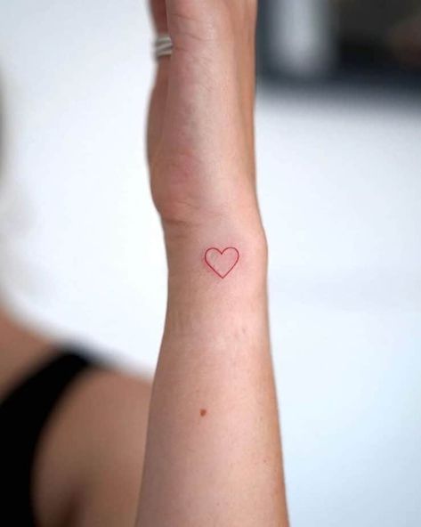 23. A red ink small heart hand tattoo Heart Tattoo Wrist Side, Red Heart On Wrist Tattoo, Small Heart Outline Tattoo, Red Heart Tattoo On Hand, Red Heart Hand Tattoo, Thumb Heart Tattoo, Heart Tattoo Inner Arm, Hand Drawn Heart Tattoo, Small Heart Tattoo On Wrist