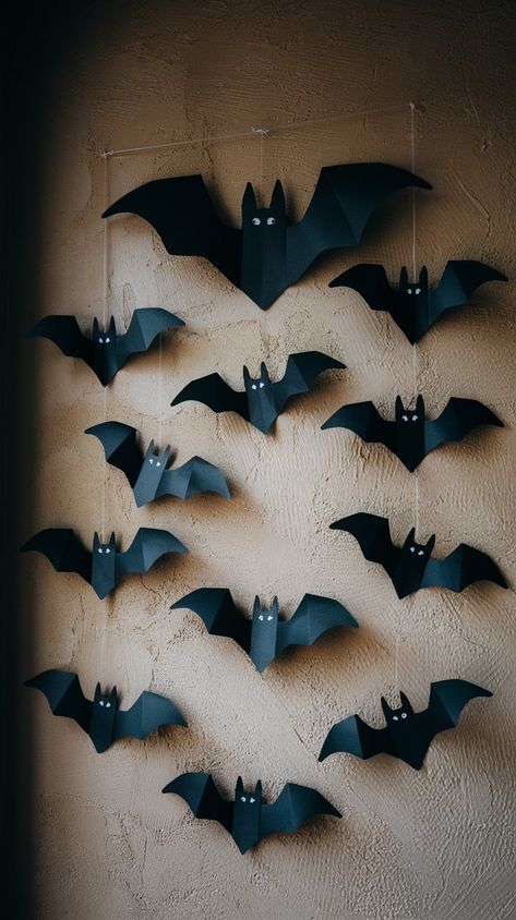 Add a spooky touch to your Halloween decor with these DIY paper bats! Perfect for creating a haunting atmosphere, these easy-to-make wall decorations bring a festive flair to any room. Simply cut out bat shapes from black construction paper and arrange them in a flight pattern across your walls. Bat Window Decor, Halloween Craft Construction Paper, Diy Halloween Decorations With Construction Paper, Construction Paper Halloween Decorations, Garage Door Halloween Decor Diy, Paper Bats On Walls, Paper Bats Diy, Homemade Halloween Decorations Indoor, Construction Paper Halloween Crafts