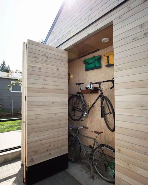 Here’s a good indoor-outdoor storage concept to conceal bikes within a hidden compartment. Image credit: INSTAGRAM @TAYLORSMITHSC Small Garden Gym, Bike Storage Small Space, Additional Dwelling Unit, Bike Storage Design, Bike Storage Ideas, Indoor Bike Storage, Outdoor Bike Storage, Outdoor Garden Storage, Shed Of The Year