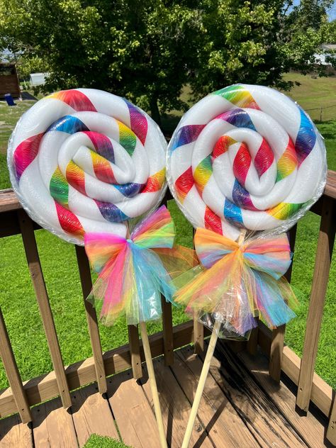 Currently on vacation so I won't be getting any packages out until Sept 30! Listing is for one Single Rainbow Lollipop with single stripe. 46" x 16-18" all weatherproof foam lollipops. These will last several years through rain and snow! (See photos for lollipops in snow and lollipops with lights attached).  I ship each lollipop with two size sticks. I'm able to save a little bit of room by having a placeholder stick instead of the full size one. just switch them out when it arrives. or you can 3d Candy Decorations, Dollar Tree Rainbow Party, Lollipop Yard Decorations Diy, Foam Lollipops Diy, Dollar Tree Candyland Diy, Lollipop Christmas Decorations, Lollipop Woods Candyland, Candyland Pep Rally, Candy Bedroom Theme