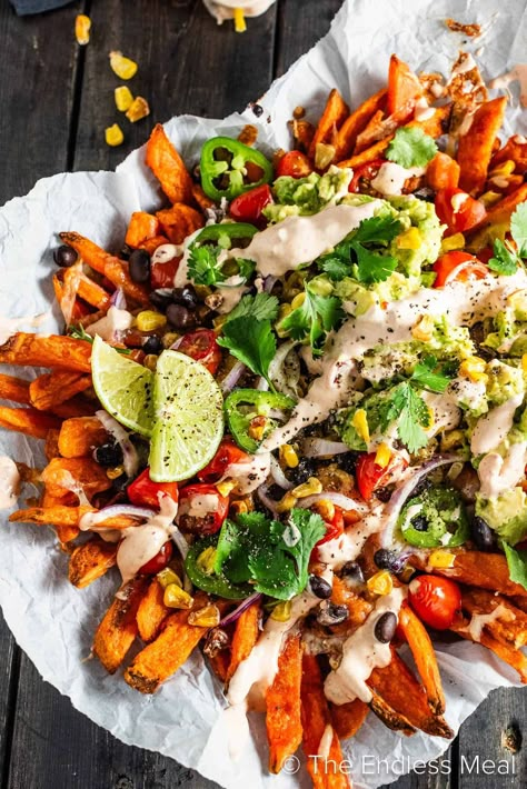 These loaded Mexican fries are made with crispy sweet potato fries layered with all the Mexican fixings and then drizzled with a spicy chipotle crema. #theendlessmeal #fries Potato Food Truck, Mexican Fries, Mexican Nachos, Mexican Sweet Potatoes, Potato Food, Nacho Fries, Healthy Fries, Crispy Sweet Potato Fries, Sweet Potato Recipes Fries