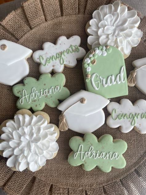 Floral Grad Cookies, 70s Graduation Party Ideas, Graduation Party Ideas Sage Green, College Themed Graduation Party, Sage Green Gold And White Graduation Party, Flower Graduation Cookies, Graduation Party Ideas Aesthetic Green, Sage Green Grad Party Decor, Graduation Party Cookie Ideas