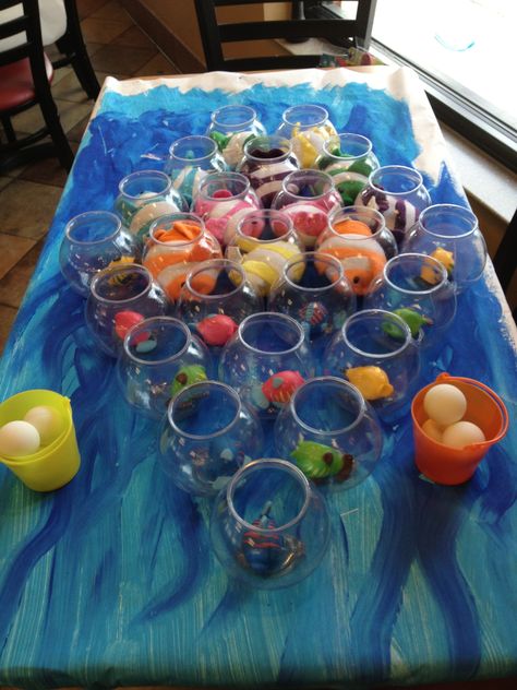 This fun under the sea themed game was found online at a party supply website… Sea Themed Party Favors, Finding Nemo Party Games, Fish Bowl Toss, Finding Nemo Games, Dory Birthday, Dory Party, Carnival Games For Kids, Bubble Guppies Birthday Party, Nemo Party