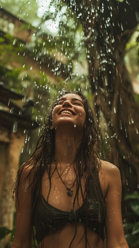 In the midst of a serene natural backdrop, a woman is immersed in a moment of pure bliss as the rain showers down upon her. The water droplets are illuminated against the verdant environment, drawing attention to the woman's joyful expression. This scene captures the essence of finding happiness in simple pleasures, surrounded by the beauty of nature. Powerful Women Images, Woman Shower Aesthetic, Pure Happiness Aesthetic, Living Your Best Life Aesthetic, Happy Women Aesthetic, Wellness Aesthetic Black Woman, Woman Powerful Aesthetic, Blissful Aesthetic, Happy Person Aesthetic