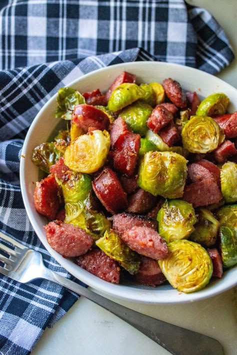 Roasted Brussel Sprouts and Kielbasa is the perfect low-carb sheet pan dinner to serve up in just 20 minutes! Made combining fresh brussel sprouts and smoky kielbasa sausage, this Roasted Brussel Sprouts and Kielbasa keto friendly meal is hearty and delicious. #sheetpandinner #sheetpanmeal #brusselsprouts #roastedbrusselsprouts #brusselsproutsandkiebasa #brusselsproutsandsausage #roastedvegetable #lowcarb #keto #ketodinner #lowcarbsheetpan Sausage And Brussel Sprouts Skillet, Brussel Sprouts With Sausage, What To Serve With Brussel Sprouts, Kielbasa Recipes Low Carb, Low Carb Kielbasa Recipes Dinners, Trendy Styles 2023, Kilbasa Sausage Recipes Healthy Low Carb, Keilbasa Recipes Low Carb, Low Carb Kielbasa Recipes