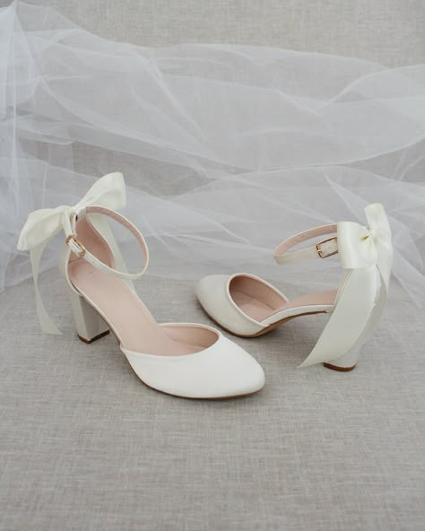 An all-time classic and elegant style with simplicity of satin heels with a satin back bow. DETAILS:HEEL HEIGHT: 3 inchesCOLORS AVAILABLE: Champagne, White, Ivory, Navy, Burgundy, and Light BlueUPPER: Synthetic upper and liningMATERIALS: Mandmade outsoleSTYLE NAME: SARAH Light Blue Heels With Bow, Wedding Flats With Bow, White High Heels With Bows, Bride Shoes Short Heel, Two Inch Heels, Bow Heels White, White Prom Shoes Low Heels, White Heels Elegant, Ivory Satin Heels