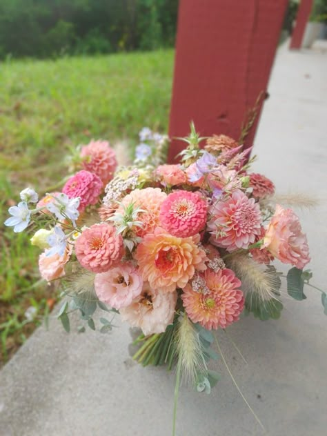 Apricot and Salmon mid Summer Bridal Bouquet of Dahlia, lisianthus, Delphinium, zinnia, and grasses Coral Dahlia Bouquet, Garden Wedding Bridal Bouquet, Zinnia Bouquet Ideas, Dahlia Flower Bouquet Wedding Ideas, Wedding Bouquets With Dahlias, Dahlia And Peony Bouquet, August Wedding Flowers Bride Bouquets, August Flowers Wedding, Dahlia And Zinnia Bouquet