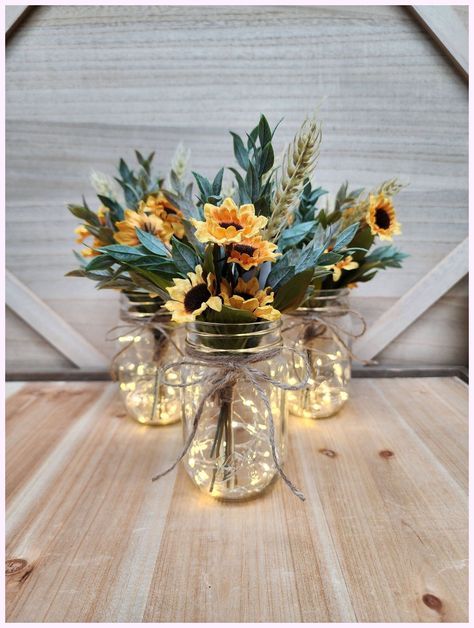 [Promotion] 'Fall Is In The Air! Choose Lighted Or Unlighted. These Beautiful Pint Sized Mason Jar Centerpieces Are Perfect For Your Next Event. They Are Very Popular For Weddings, Baby Showers, Parties, Corporate Events, Holiday Events, And Any Other Event That Requires Table Centerpieces. They Also Look Great In Any Room Of Your House Or Office. To See Other Lighted Jar Options And All Of My Other Listings, Please View My Shop: #masonjarfallcenterpiecesparty Mason Jars With Lights, Sunflower Wedding Centerpieces, Fall Mason Jar Centerpieces, Jar Centerpiece Wedding, Sunflower Wedding Decorations, Mason Jar Centerpiece, Fall Mason Jars, Sunflower Themed Wedding, Jar Centerpieces