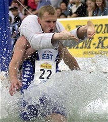 Wife Carrying competition in Finland - Sling your wife over your back and carry her across the finish line.