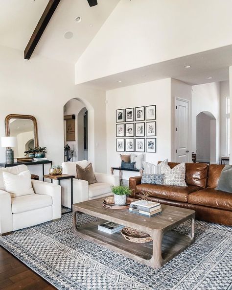 Warm white walls with dark wood ceiling beams; gallery wall; and cozy modern seating area create a lovey living room #farmhouse #modern #boho Eclectic Farmhouse, Leather Couch, Farmhouse Decor Living Room, White Living Room, Lounge Decor, White Living, Family Room Design, Style At Home, Living Room Inspo