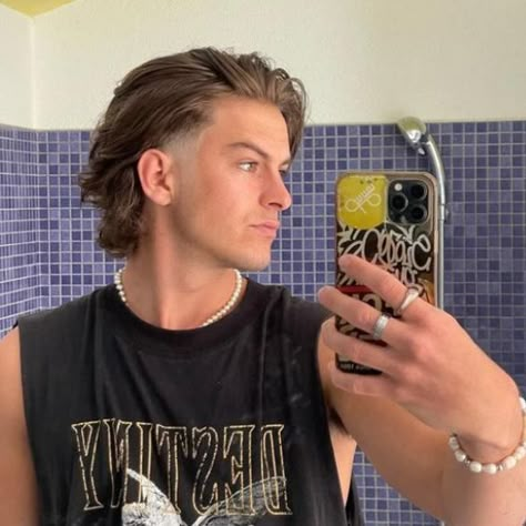 15 Wolf Cut Hairstyles For Men To Try In 2024 Long Hair With Faded Sides Men, Taper With Long Hair Boy, Rambo Hairstyle, Pushed Back Mullet, Long Hair With Taper, Long Hair Fade Men, Mid Length Mens Haircut, Long Hair Undercut Men, High Fade Mullet