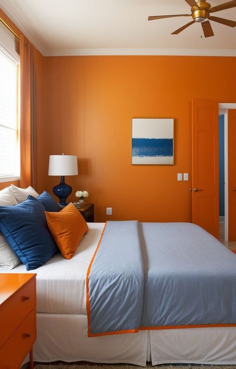 Create a striking blue and orange color scheme in your bedroom by using a statement wall with bold blue paint and adorning it with orange accents, such as throw pillows and curtains. Complete the look with a sleek white dresser and gold decorative accents for a modern and vibrant aesthetic. Orange Bedroom Aesthetic, Blue And Orange Bedroom, Navy Blue Headboard, Blue Headboard, Pastel Bedroom, Orange Bedroom, Orange Color Schemes, Pastel Theme, Bedroom Orange