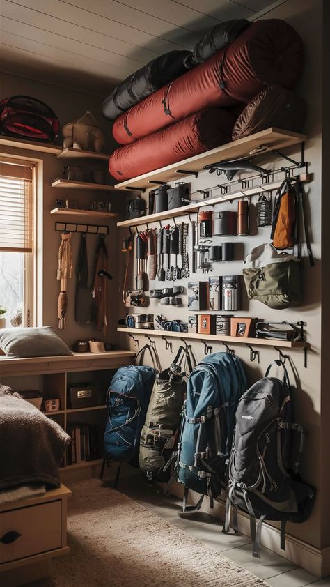 A small room with a well-organized camping gear wall, featuring neatly arranged outdoor gear on shelves and hooks. Camping Gear Wall, Gear Room Organization, Gear Room Ideas, Room Ideas For Adults, Outdoor Gear Storage, Camping Gear Organization, Gear Organization, Camping Gear Storage, Interior Decoration Ideas