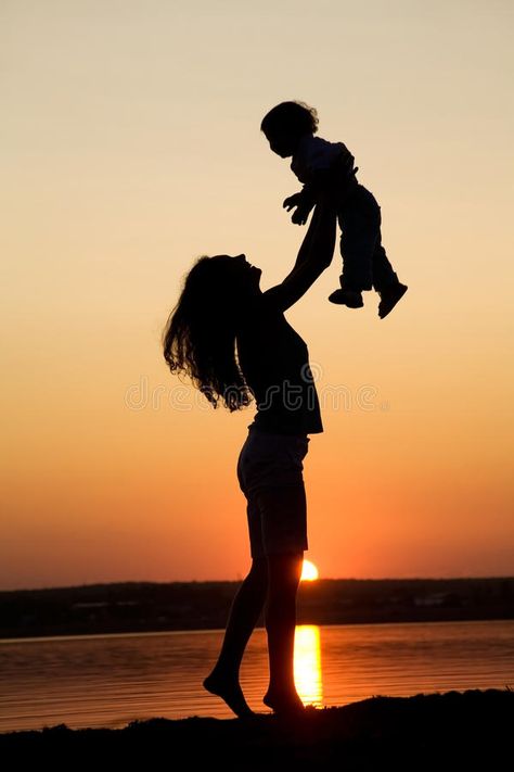 Photo about Silhouette of mother which turns the child against a sunset and water. Image of night, parents, evening - 11704254 Mother And Child Pictures, Mother Daughter Art, Mother Photos, Mother Pictures, Mother Images, Silhouette Photography, Sunset Silhouette, Mother Art, Mom Son