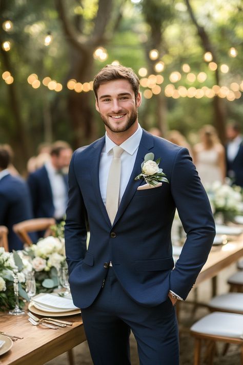 Elevate your wedding style with our top tips for matching groom and groomsmen looks effortlessly. Create a cohesive and stylish bridal party that adds charm to your wedding day. Explore more ideas to inspire your perfect celebration!  #WeddingStyle #GroomAndGroomsmen #WeddingPlanning #BridalPartyLooks #WeddingInspiration #GroomsmenAttire #WeddingTips #MatchingLooks #WeddingFashion #ElegantWeddings #BridalTrends #WeddingDecor #StylishGrooms #ModernWedding #GroomStyle Midnight Blue Groomsmen Suits, Navy Blue And Gold Tuxedo Wedding, Navy Blue Suit With Emerald Green Tie, Mens Navy Suits, Navy Suits Groomsmen Color Schemes, Navy And Cream Wedding Colors, Navy Suit Wedding Party, Groomsmen Summer Attire, Men’s Blue Wedding Suit