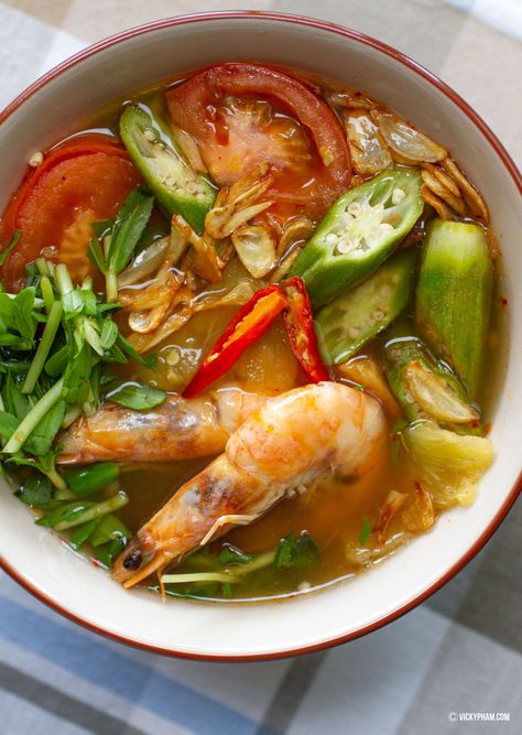 Vietnamese sweet and sour soup (canh chua) is an example of everything that is great about Vietnamese home cooking. It uses a variety of fresh vegetables and herbs to produce a soup of contrasting yet complementary textures and flavors. Vietnamese Sour Soup, Cambodian Sour Soup, Vietnamese Sweet And Sour Soup, Vietnamese Vegetable Recipes, Healthy Vietnamese Food, Carrot Potato Soup, Sweet And Sour Shrimp, Sweet And Sour Soup, Lemongrass Soup