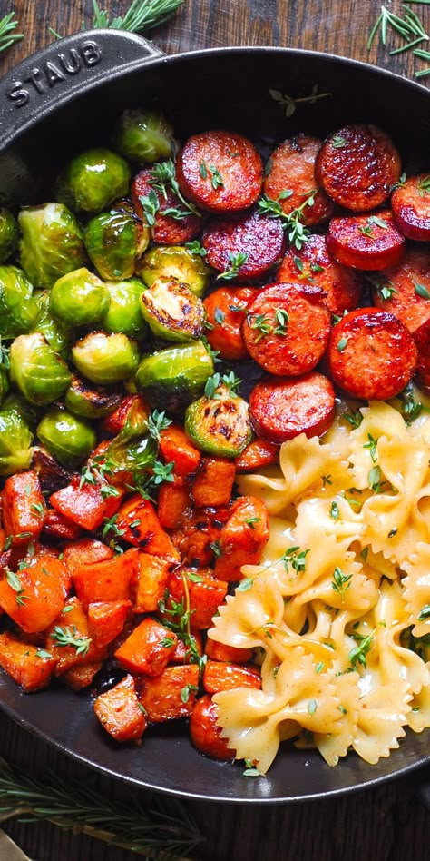 Autumn Dinner with Sausage, Pasta, Brussels Sprouts, Butternut Squash, Garlic Butter Sauce in a cast iron pan. Dinner With Sausage, Brussels Sprouts And Butternut Squash, Bow Tie Pasta, Autumn Dinner, Garlic Butter Sauce, Sausage Pasta, Fall Dinner, Smoked Sausage, Butter Sauce