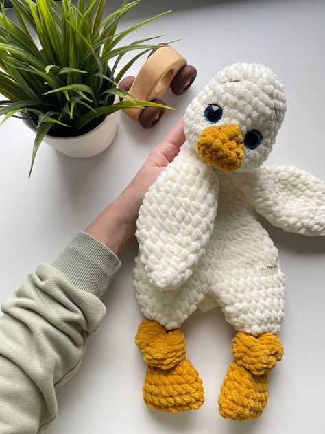 Crochet PATTERN ONLY. Amigurumi Duck Baby comforter. Duck Lovey. Plush toy Snuggler. Stuffed animal with hollow body tutorial. PDF download. Crochet toys tutorial #crochettoystutorial #crochet #crochettoy #crochetpattern #crochetpatterns 3.465 Chicken Snuggler Crochet, Ocean Lovey Crochet, Chunky Yarn Lovey, Crochet Bunny Snuggler Pattern, Duck Lovey Crochet Pattern, Duck Snuggler Crochet Pattern, Crochet Bokoblin, Duck Snuggler Crochet Pattern Free, Crochet Duck Snuggler Free Pattern