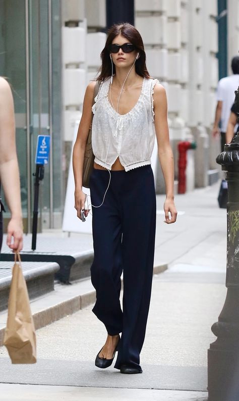 Kaia Gerber Just Wore a Sleeveless Blouse in the Most French-Girl Way | Who What Wear Kaia Gerber Style Street, Kaia Gerber Outfits, Kaia Gerber Street Style, Kaia Gerber Style, Lace Trim Cami Top, Soho New York, White Sleeveless Blouse, Blouse Models, Just Style