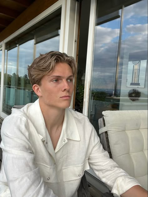 Blonde boy with middle part chilling on the balcony Male Short Middle Part, Mens Blonde Short Hair, Scandinavian Hairstyles Men, Old Money Middle Part Hair Men, Blonde Man Hairstyle, Hair With Middle Part, Blond Mens Haircut, Mens Short Middle Part, Men’s Short Middle Part