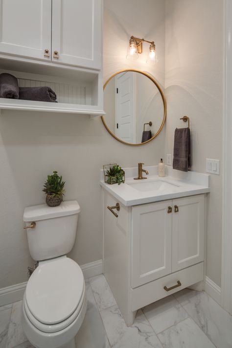 Restroom With Gold Fixtures, Small Bathroom Gold Hardware, All White And Gold Bathroom, Bathroom White Cabinets Gold Hardware, Gold Theme Bathroom Ideas, White Gold Restroom, Small Bathroom Remodel Gold Fixtures, Small Bathroom Ideas With Gold Fixtures, White And Gold Half Bath