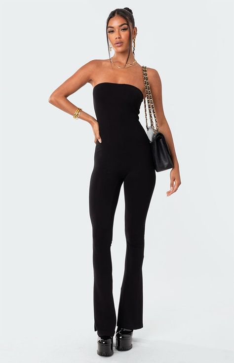 Online Only! This strapless jumpsuit features a flared leg with side slits, adding a little something extra to your outfit. The versatile design makes it perfect for any season, with the option to layer with jackets or sweaters in cooler weather or accessorize with sandals in warmer months.   	Jumpsuit 	Strapless neckline 	Flared leg 	Side Slits 	Polyester, Spandex 	Model wears size S 	Model height is 5'7 	Item care: Wash with similar color Flare Jumpsuit Outfit, Womens Jumpsuits Formal, Strapless Jumpsuit Outfit, Flared Jumpsuit, Black Strapless Jumpsuit, Visionary Fashion, Solid Color Jumpsuits, Flare Jumpsuit, Designer Jumpsuits