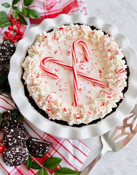 You'll love this no bake Candy Cane Pie that's made with cream cheese, real peppermint and crushed candy canes on an Oreo crust. It's the perfect peppermint pie recipe for the holiday season! Village Inn Candy Cane Pie Recipe, No Bake Candy Cane Pie, Candy Cane Pie Recipe, Peppermint Pie Recipe, No Bake Candy, Peppermint Pie, Candy Cane Pie, Peppermint Desserts, Candy Cane Dessert