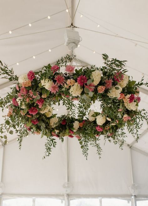 Large floral statement pieces like this gorgeous chandelier bring the wow factor at a wedding reception and can help set the tone for a truly special evening. White Floral Chandelier, Flower Chandelier Wedding, Flower Chandelier Diy, Floral Chandelier Wedding, Chandelier Wedding Decor, Bridal Suite Decor, Hanging Flower Arrangements, Forest Theme Wedding, Sunflower Themed Wedding