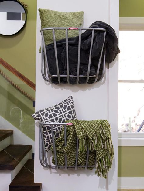 Repurposed hay-rack feeders designed for use in stable stalls are perfect in this context as simple wall-mounted storage baskets. (http://www.hgtv.com/on-tv/an-amazing-barn-conversion-from-hgtvs-elbow-room/pictures/index.html?soc=hgtvcom25992536) Blanket Storage Living Room, Basket On Wall, Hay Rack, Blanket Holder, Hay Racks, Barn Conversions, Blanket Rack, Living Room Blanket, Blanket On Wall