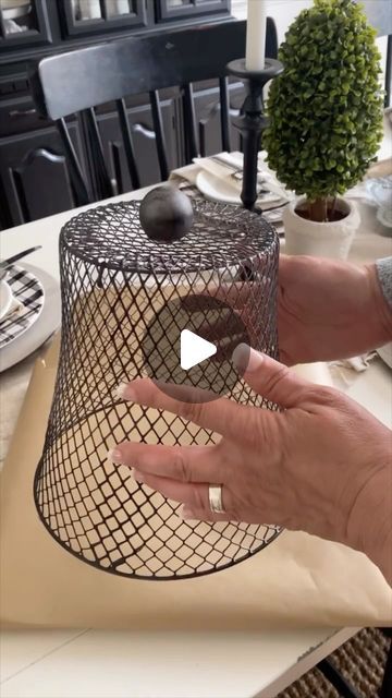 Jennifer Dempsey on Instagram: "Make an easy wired cloche using a Dollar Tree wired basket. 

They sell them in black too but I used white and spray painted it with a metallic spray paint I had on hand and added a knob too. 

So easy and looks so cute! I plan on making more to use outdoors too! 
.
.
#dollartreediy #easydiy #homedecordiy #dollartree #dollartreefinds #makeiteasy #cuteandeasy #cottagedecor" Dollar Tree Wire Basket Ideas, Wire Basket Decor Ideas, Wire Basket Ideas, Wire Basket Decor, Basket Decor Ideas, Mother Thyme, Cloche Decor, Basket Centerpieces, Dollar Tree Ideas