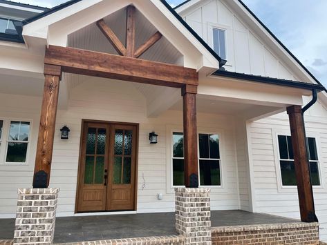 Brown Columns Front Porches, Raised Front Porch Design, White House Wood Columns, Vaulted Front Porch Entry, Wooden Posts Front Porch, Beige Farmhouse Exterior, Christian House, White Farmhouse Exterior, Lake Houses Exterior