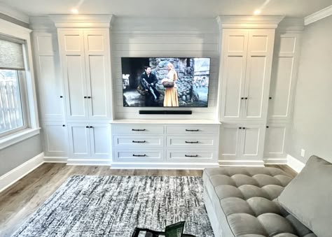 Built In Entertainment Center With Storage, Built In Media Storage Wall, Tv Wall Storage Ideas Bedroom, Basement Tv Wall With Storage, Bedroom Built Ins Around Tv, Living Room Storage Wall With Doors, Bedrooms With Built In Storage, Toy Room Entertainment Center, Custom Dressers Bedrooms