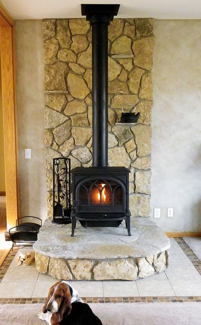 This wood stove uses Buechel Stone's Glacier River Rock for the back and risers, and Fond du Lac Steppers for the hearth pad area. Want to see more? Check out www.buechelstone.com/shoppingcart/products/Glacier-River-... Tiled Hearth, Wood Burning Stove Corner, Corner Wood Stove, Wood Stove Surround, Stove Hearth, Hearth Pad, Stove Decor, Wood Stove Hearth, Wood Stove Wall