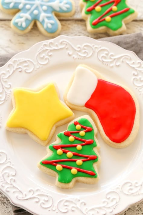 Super soft cut-out sugar cookies decorated with an easy 4-ingredient icing. These Christmas Cut-Out Sugar Cookies are so fun to decorate and perfect for the holidays! Sugar Cookie Recipe With Shortening, Sugar Cookie Cutout Recipe, Rolled Sugar Cookie Recipe, Decorated Christmas Cookies, Roll Out Sugar Cookies, Christmas Sugar Cookie Recipe, Christmas Cutout Cookies, Cut Out Cookie Recipe, Delicious Christmas Cookies