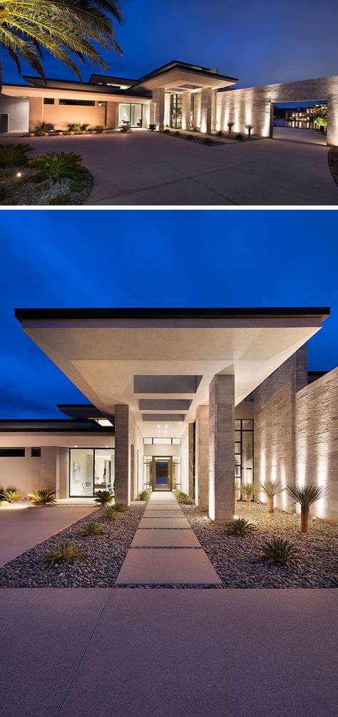 Setback from the road, the modern house has a covered entry with uplighting, and an oversized glass front door. #ModernHouse #Landscaping #Architecture Living On An Island, Landscaping Architecture, Vegas House, Covered Entry, Modern Desert, Architecture Homes, Desert House, Clerestory Windows, Luxury Garden