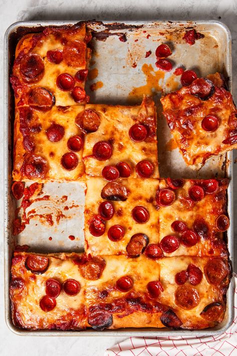 This might be your new favorite homemade pizza recipe. Sicilian pizza is an Italian-style pie identified by its thick, chewy, bready crust—similar in texture to a slab of focaccia, but under a layer of toppings like tomato sauce and other ingredients. Our best quick method for Sicilian pies at home relies on an olive-oil-enriched dough and a little parbaking. Sicilian Tomato Pie, Sicilian Pizza Dough Recipe, Authentic Sicilian Pizza Recipes, Sicilian Pizza Recipe, Pizza Dough Recipe Quick, Pizza Pie Recipe, Pizza Dough Napoletana, Sicilian Style Pizza, Holiday Ham Recipes