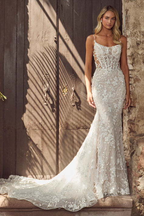 In this wedding dress with an overskirt,there’s no doubt in our minds that you’ll evoke the same majesty of Hera and feel just as beautiful as the goddess herself.Featuring a sheath silhouette adorned with sparkling sequins and intricate lace,this dress transforms with a detachable overskirt,making the arrival at the reception even more breathtaking.Her spaghetti straps create an airy feel, while her low back exudes allure, allowing brides to glide down the aisle while  blending sophistication. Strappy Sheath Wedding Dress, Lace Wedding Dress For Short Women, Mermaid Wedding Dress Corset Top, Wedding Gown Bodycon, Lace Sparkly Wedding Dress, Beaded Tight Wedding Dress, Wedding Dress For Blondes, Pearl Fitted Wedding Dress, Floral Lace Wedding Dress Fitted